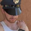 Aaron is wearing Love/Peace Police Badge and LTY Design Pin